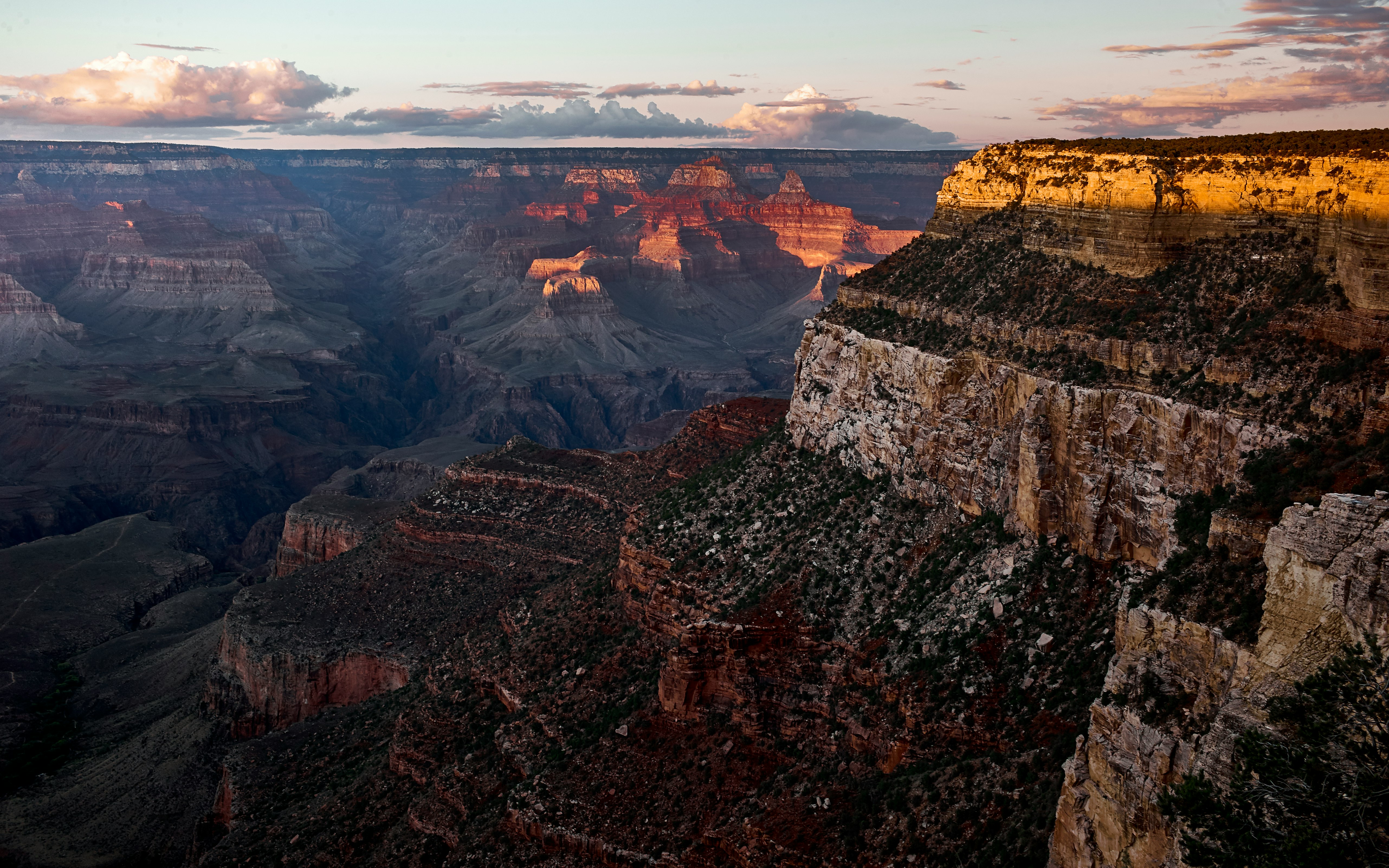 brown grand canyon under cloudy sky